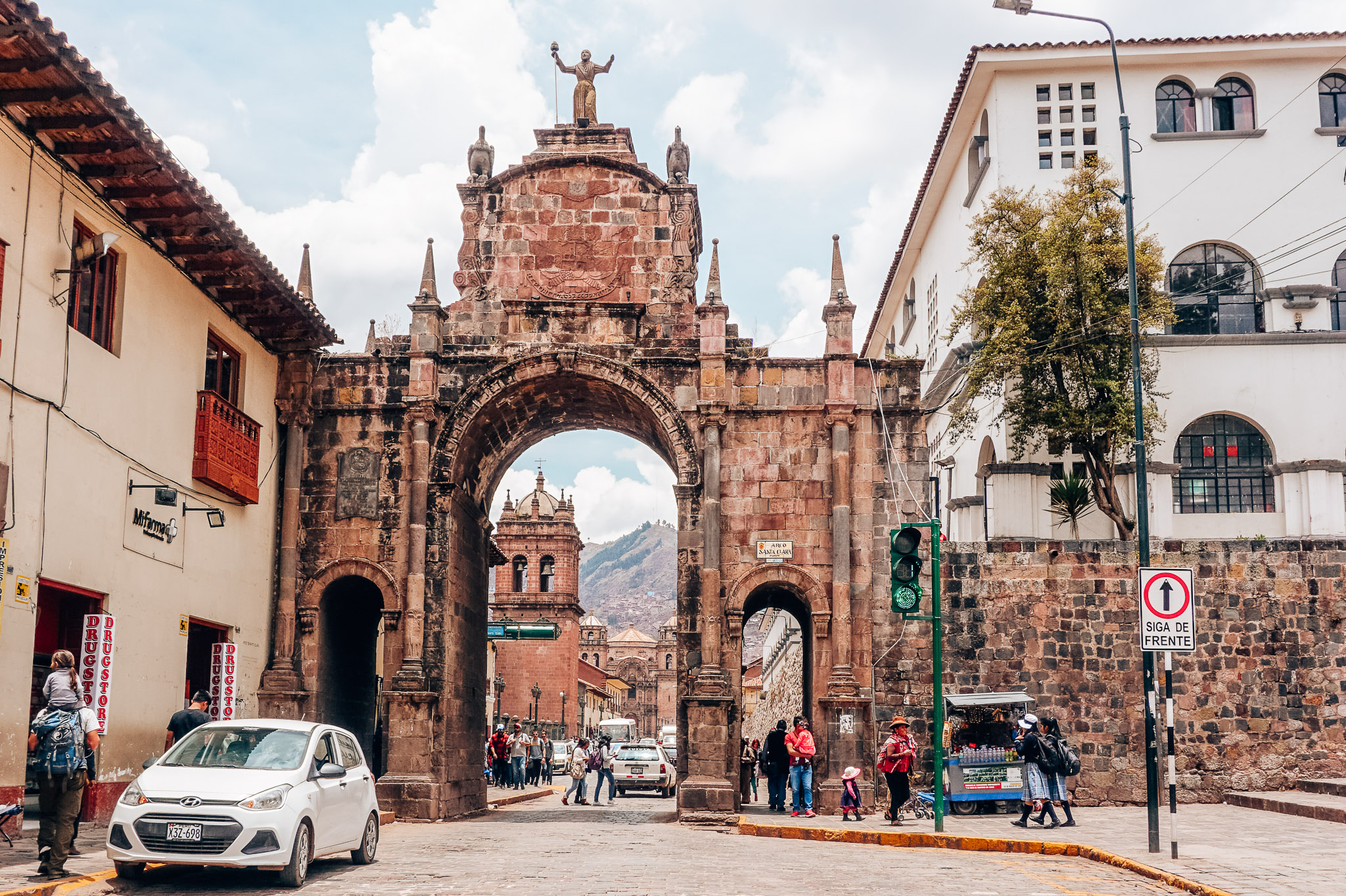 Woman strolling through quaint alleyway in charming Cusco, Peru